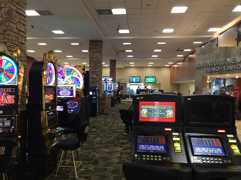 The slot machines at the airport are currently owned & operated by The South Point Hotel & Casino.You would think the payback percentage is the same as at the casino itself.There have been a few big winners at the airport in the past few months!