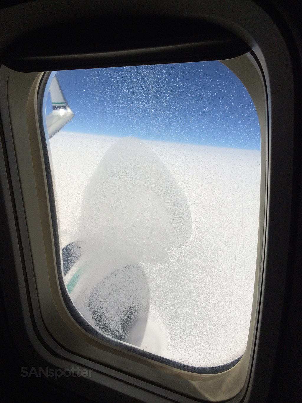 window covered in frozen condensation