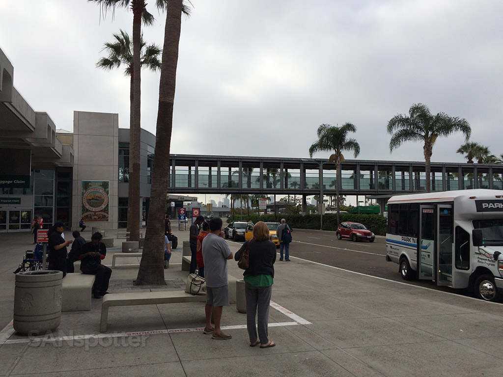 standing outside terminal 1 at SAN curbside