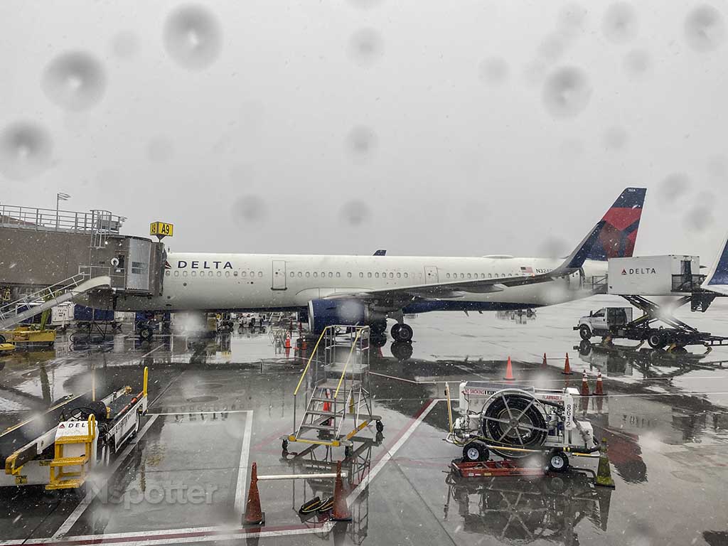 flying with a box as luggage in the rain