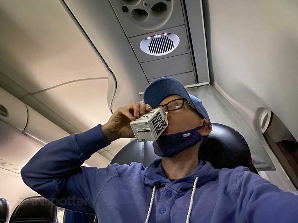 SANspotter drinking boxed water Alaska Airlines