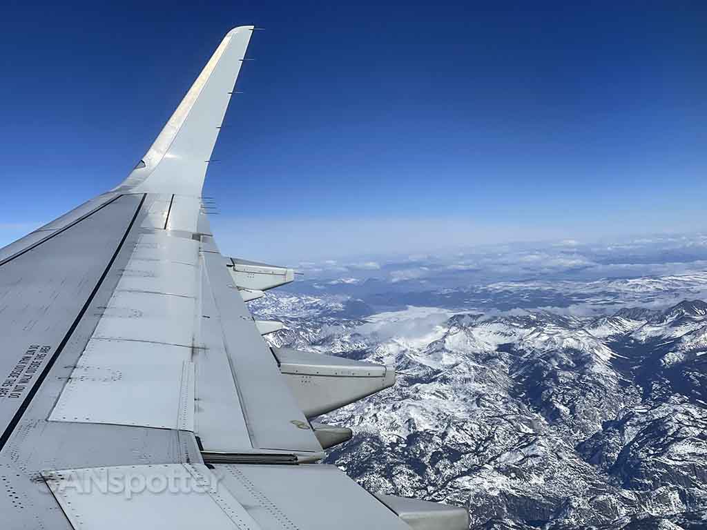 Flying over snowy Sierra Nevada mountains 