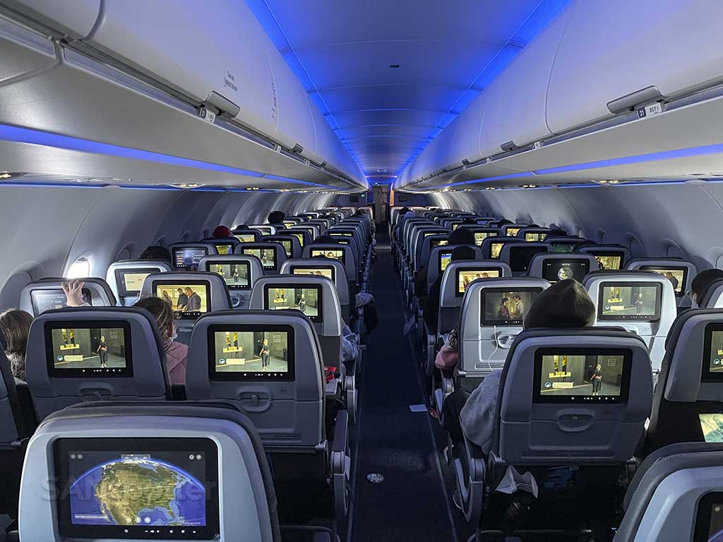 View of entire jetblue a321 interior from the back