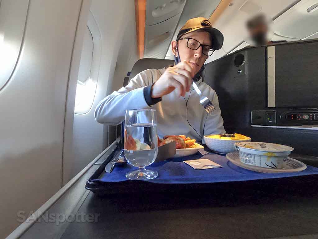 SANspotter selfie eating breakfast United business class