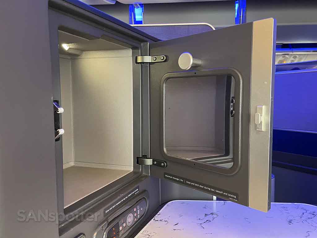 United 777-300er business class seat storage bins