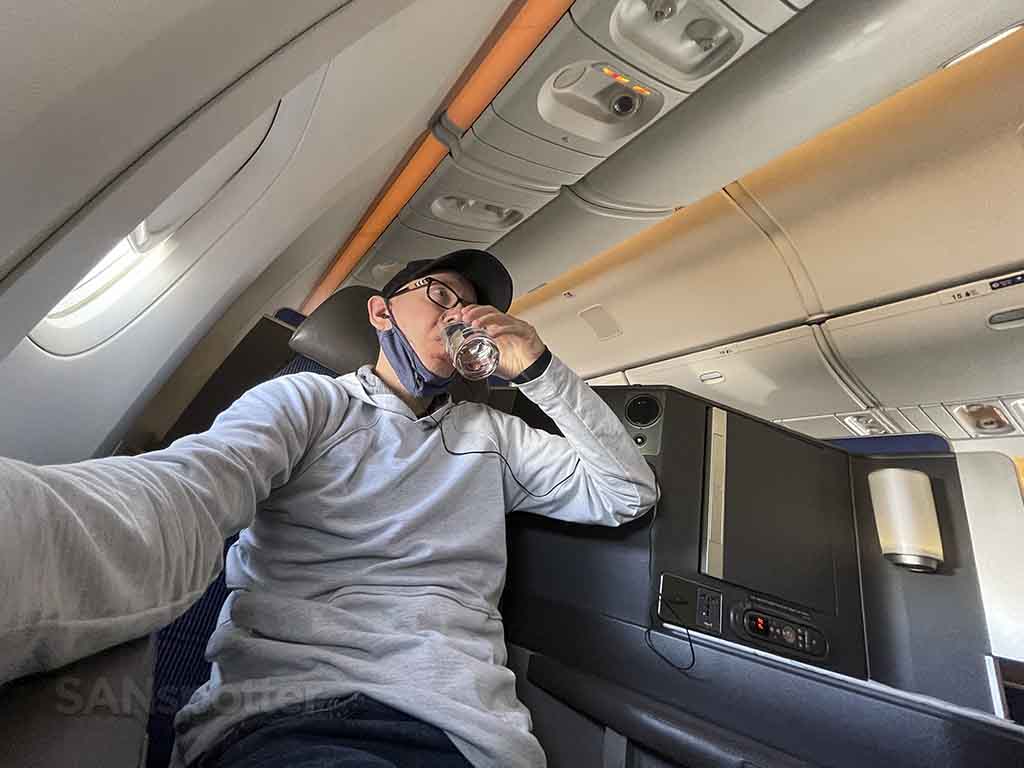 SANspotter selfie drinking water United business class 