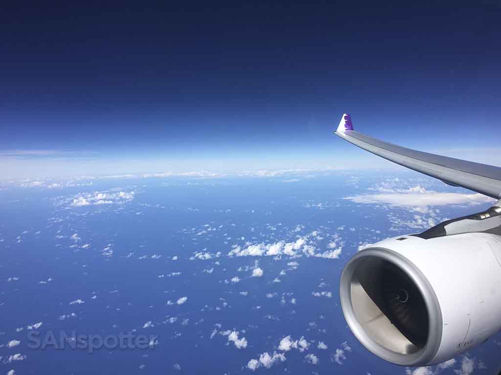 Hawaiian airlines a330 flying over the ocean 