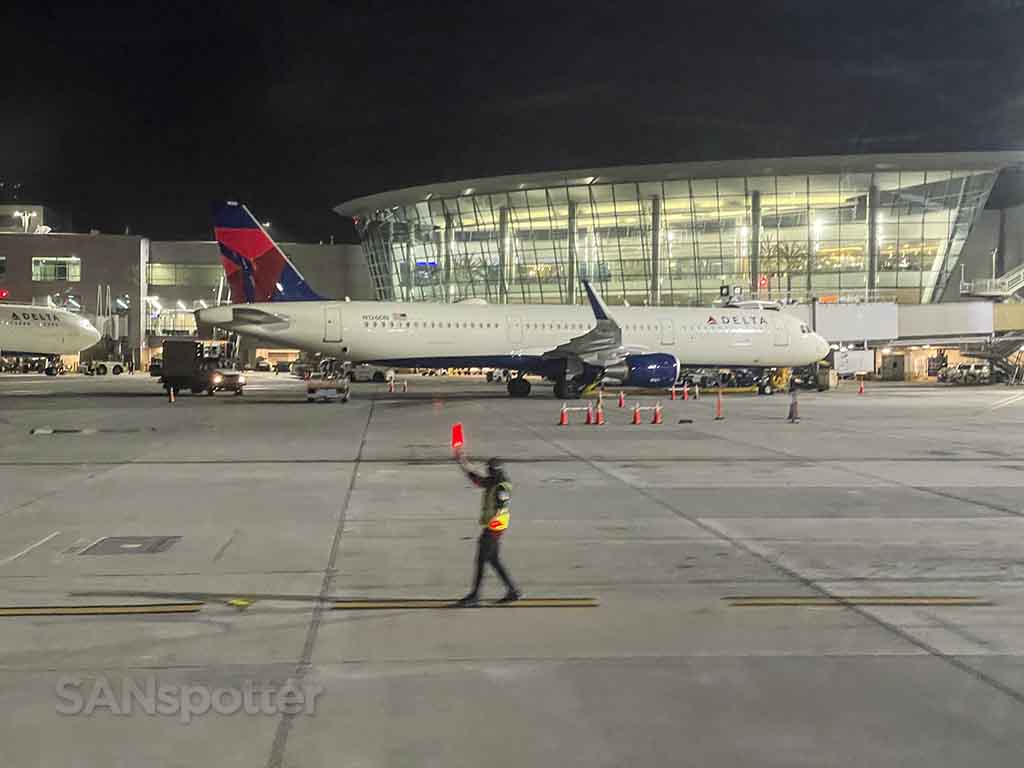Delta a321 parked at terminal 2 west San Diego airport at night