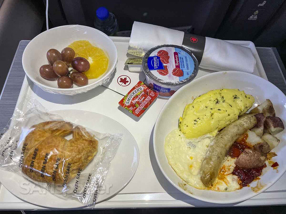Air Canada A220-300 business class eggs and sausage breakfast 