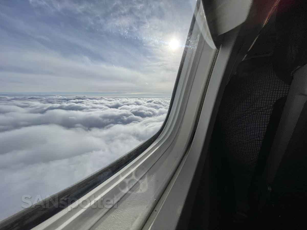 Embraer 145 flying above the clouds 