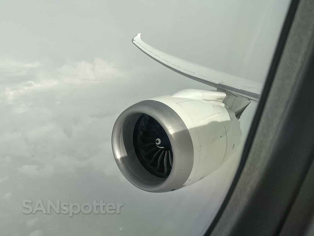 Climbing through clouds Boeing 787-9 engine and wing