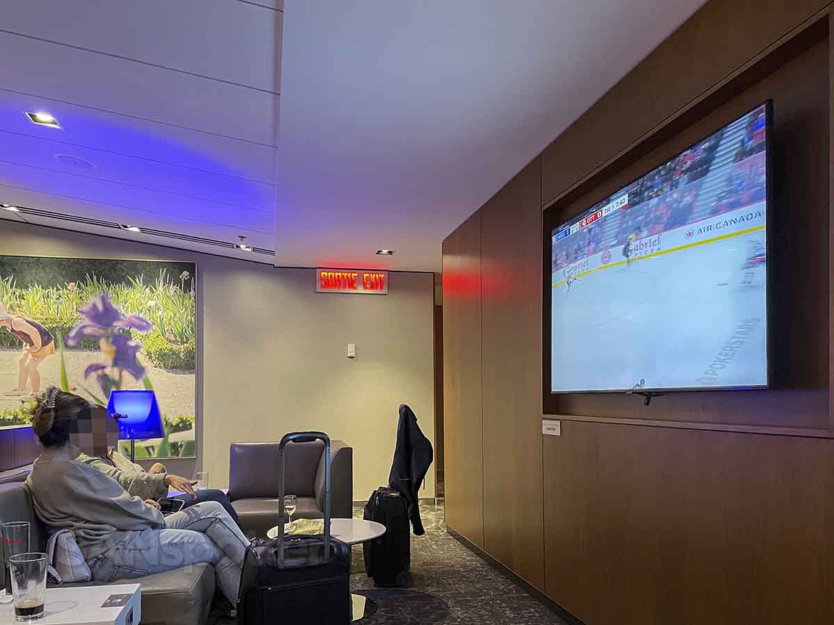 Air Canada Montreal business class lounge hockey on tv