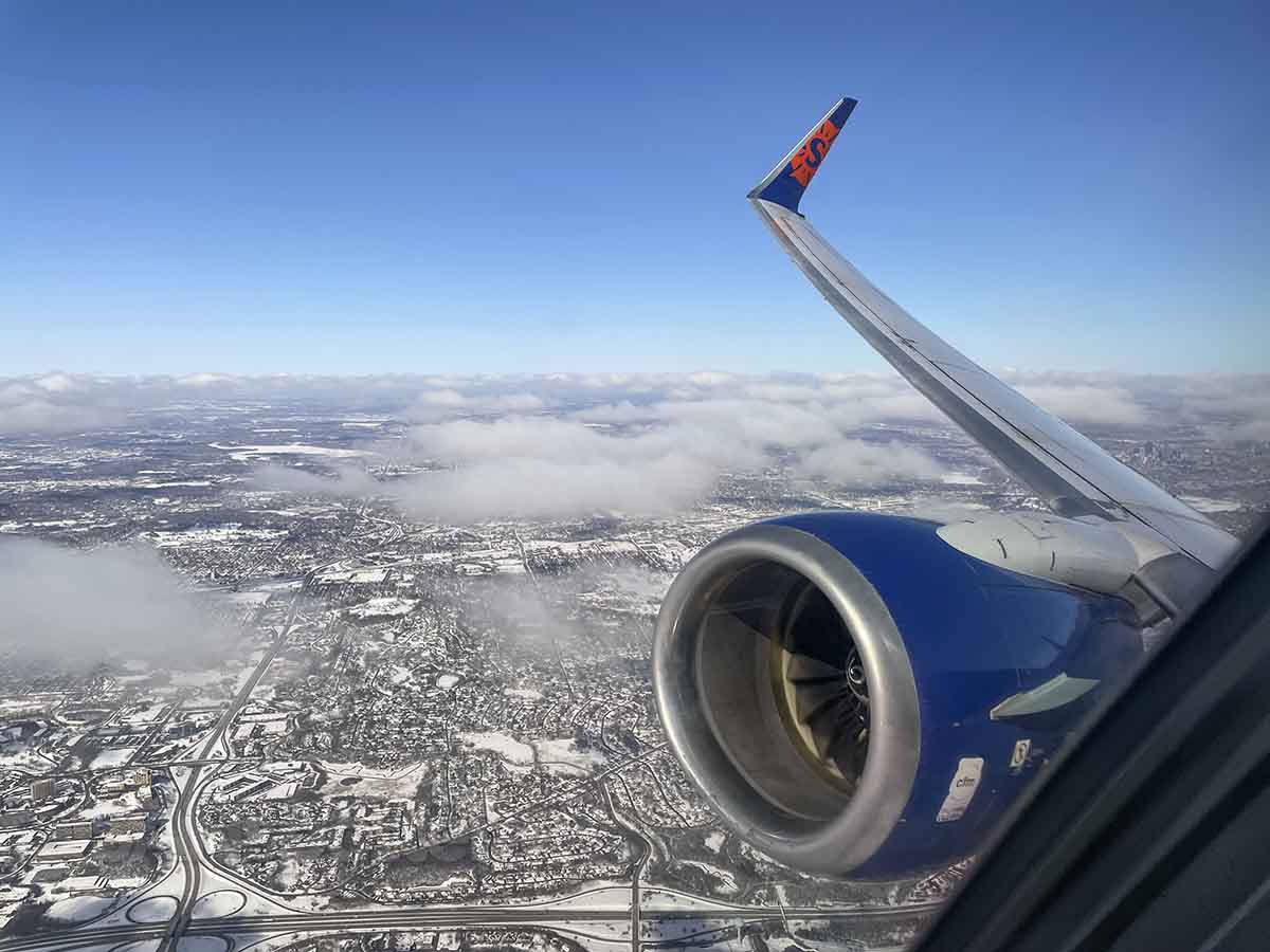 Sun country 737-800 engine and wing view after takeoff from MSP