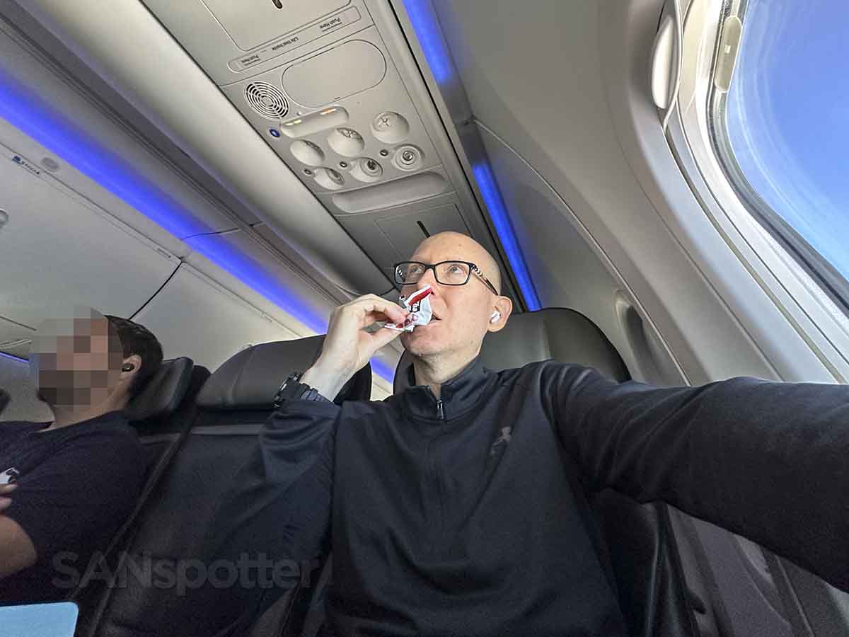 SANspoter eating in Alaska Airlines 737 MAX 9 Premium Class
