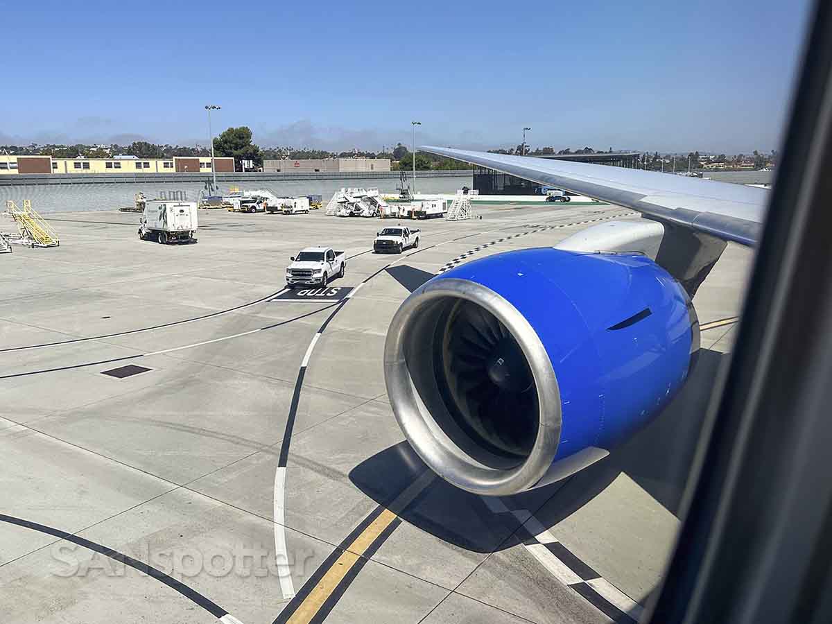 United 777–200 pulling up to the gate at the San Diego airport