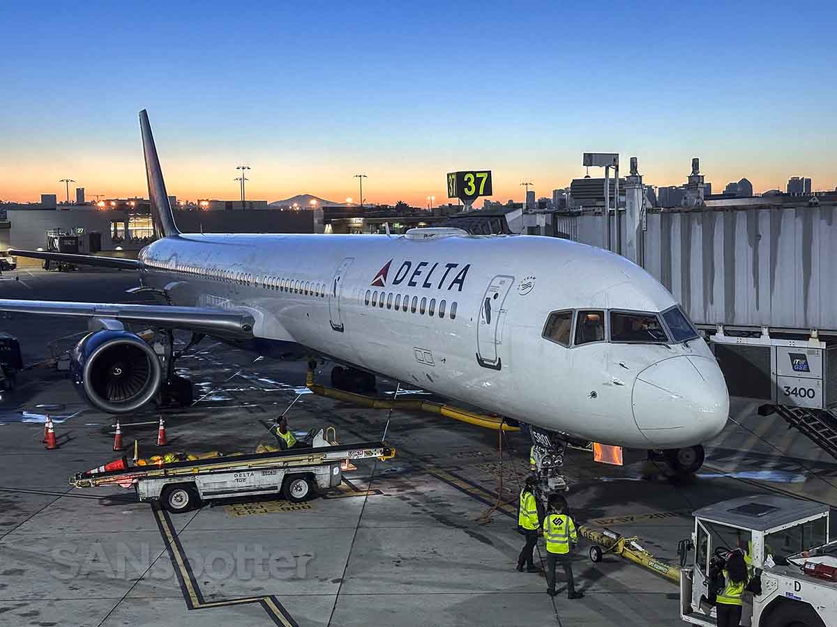 Delta 757-300 parked at gate 37 San Diego airport at sunrise