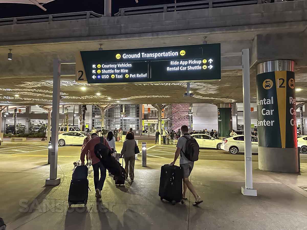 Following the signs to the ride app pickup area San Diego airport