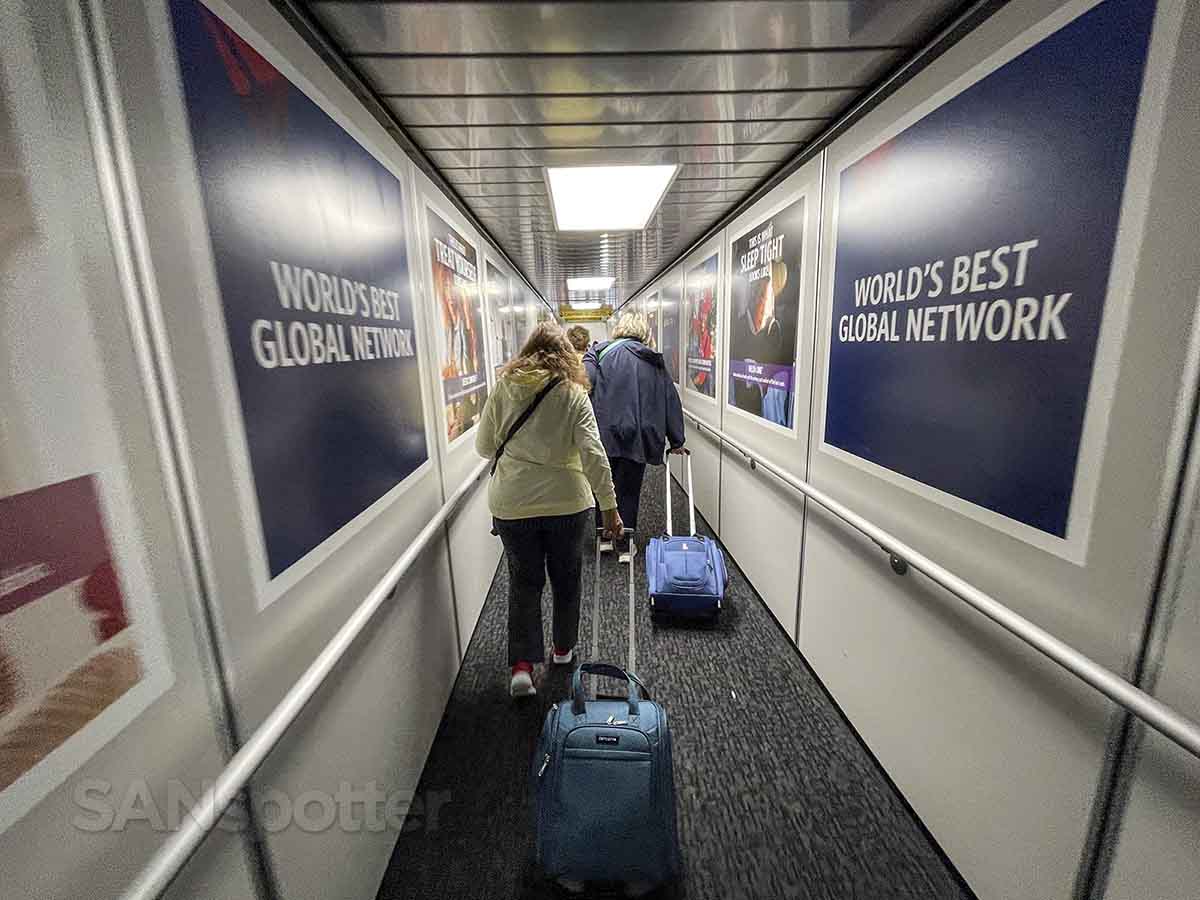 Delta Comfort Plus passengers walking down jet bridge at ATL