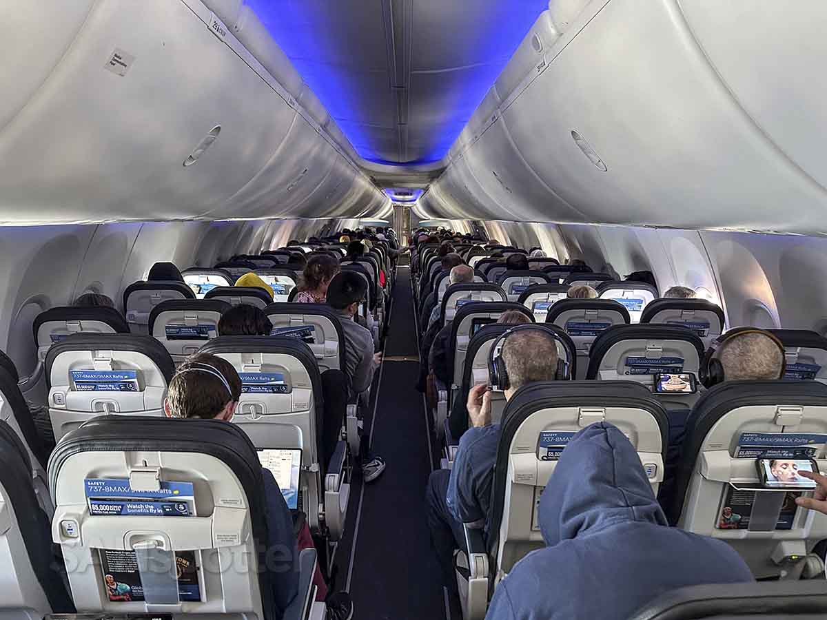Alaska Airlines 737 MAX 9 economy class cabin view from the rear looking forward
