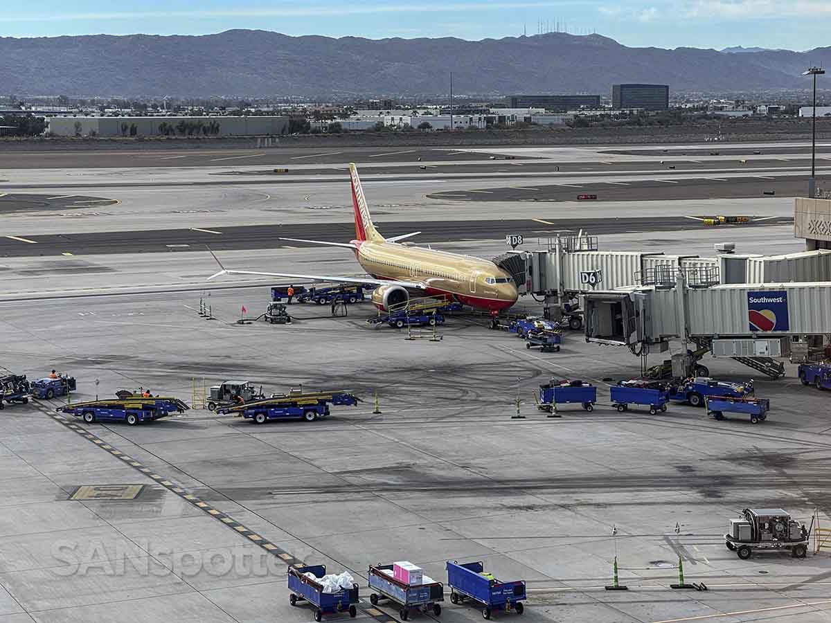Southwest 737 MAX 8 special livery parked at gate D8 PHX