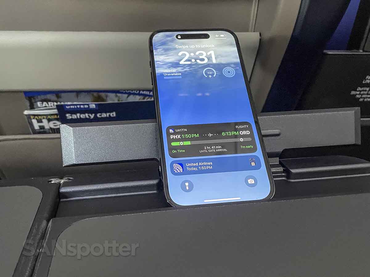 United A321neo first class tray table personal device holder
