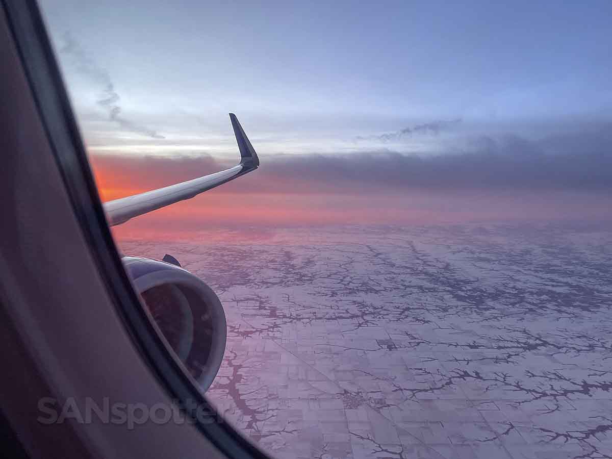 Sunset over the frozen northern plains in a United A321neo