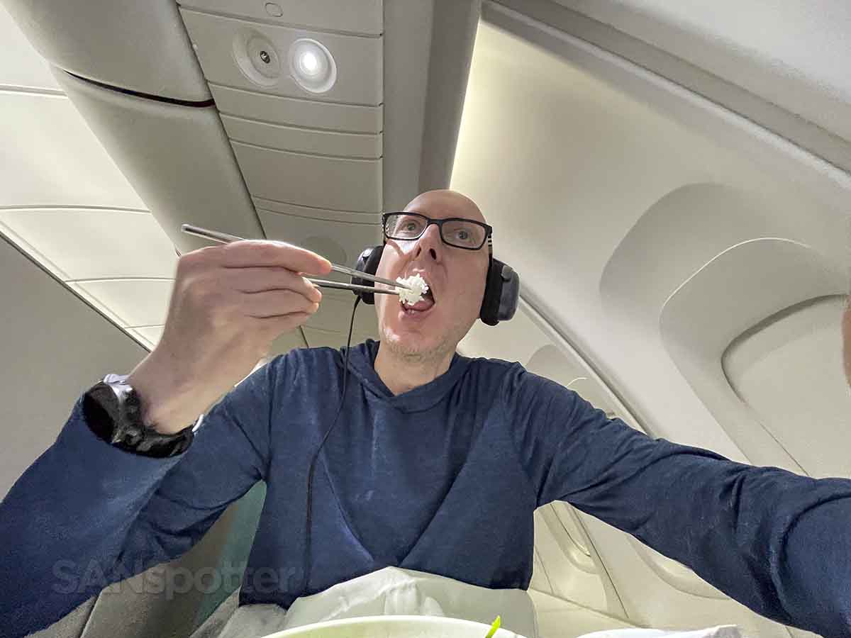 SANspotter eating rice with chopsticks