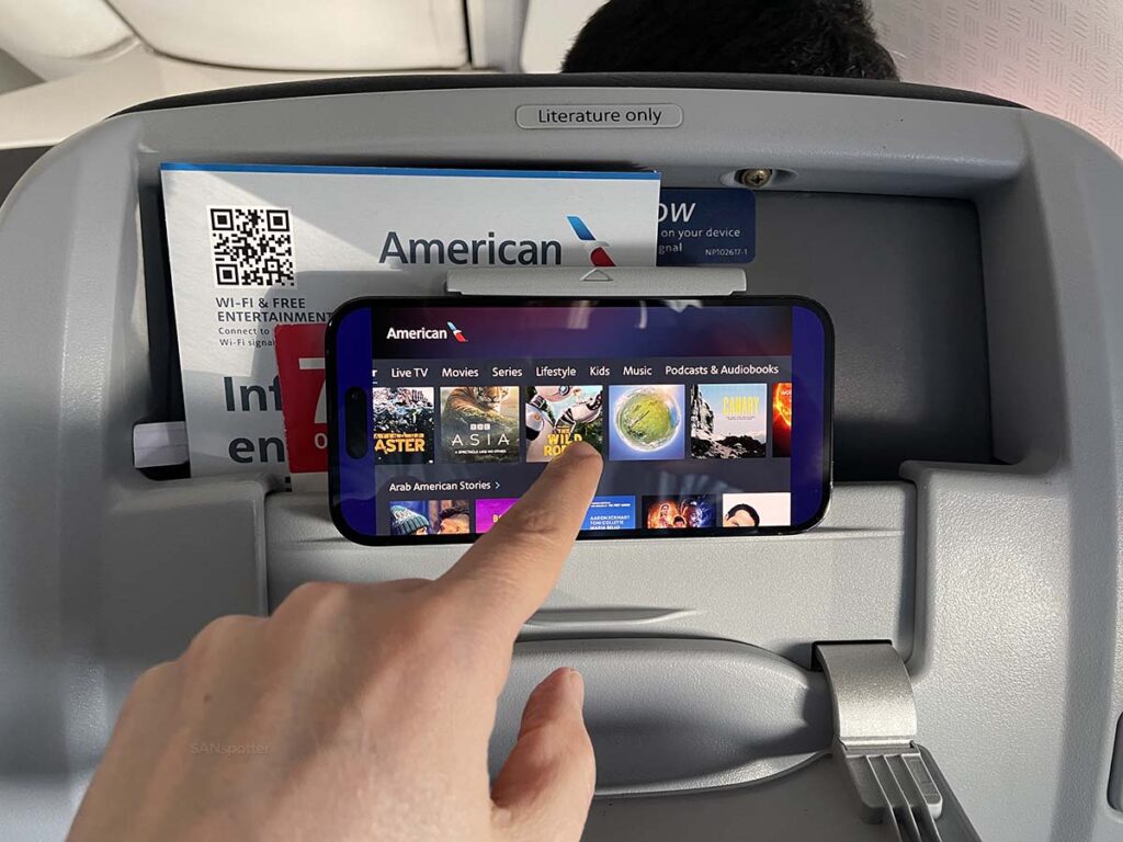 Watching the streaming in-flight entertainment and American Airlines main cabin extra