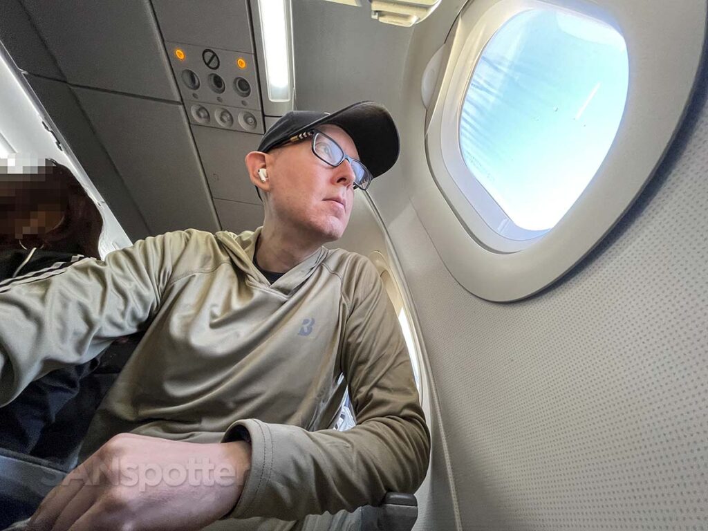 SANspotter looking out the window of an American Airlines A321 main cabin extra seat