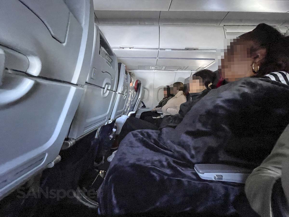 Passengers sleeping in American Airlines A321 main cabin extra seats