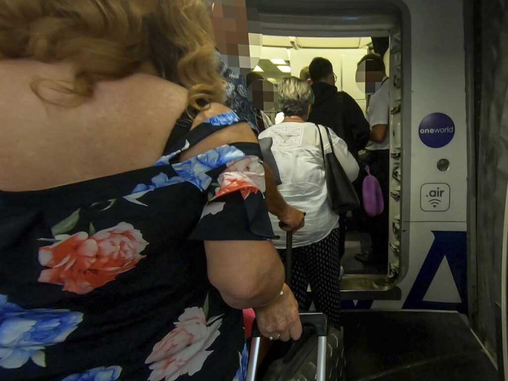 Lining up to board a British Airways 777-300ER through the forwarding boarding door at the Dubai international airport