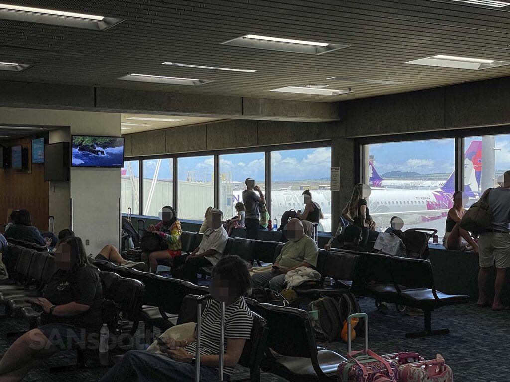 Passengers waiting for a Hawaiian Airlines flight at gate 27 Maui Kahului airport