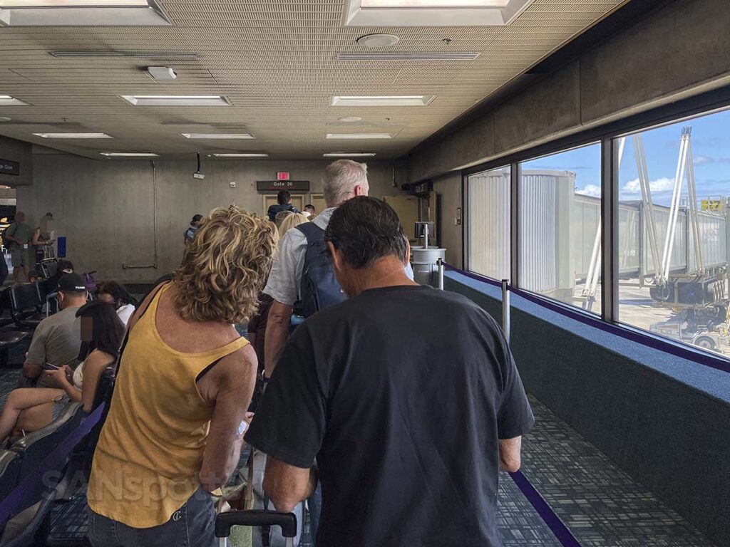 Passengers lining up to board a Hawaiian Airlines flight at the Maui Kahului airport