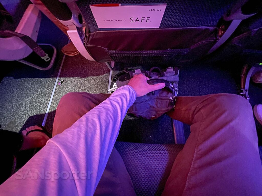 Retrieving my backpack from underneath the seat in front of me in Hawaiian Airlines A321neo Extra Comfort