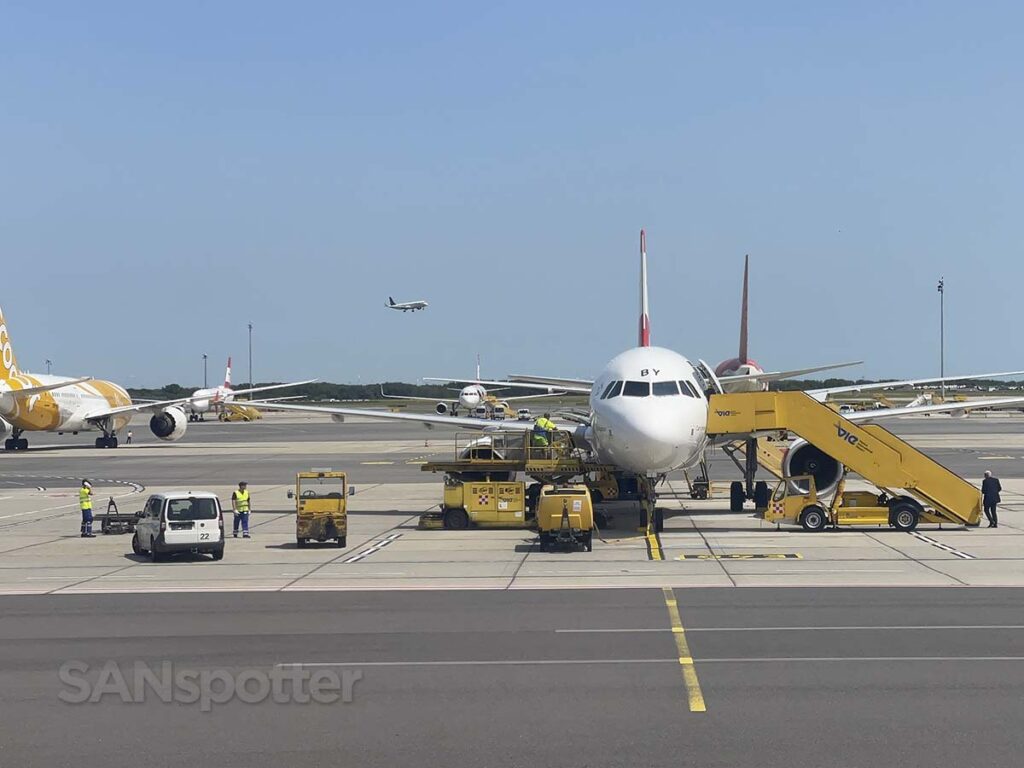 Passing by a parked aircraft while taxiing to terminal at Vienna airport
