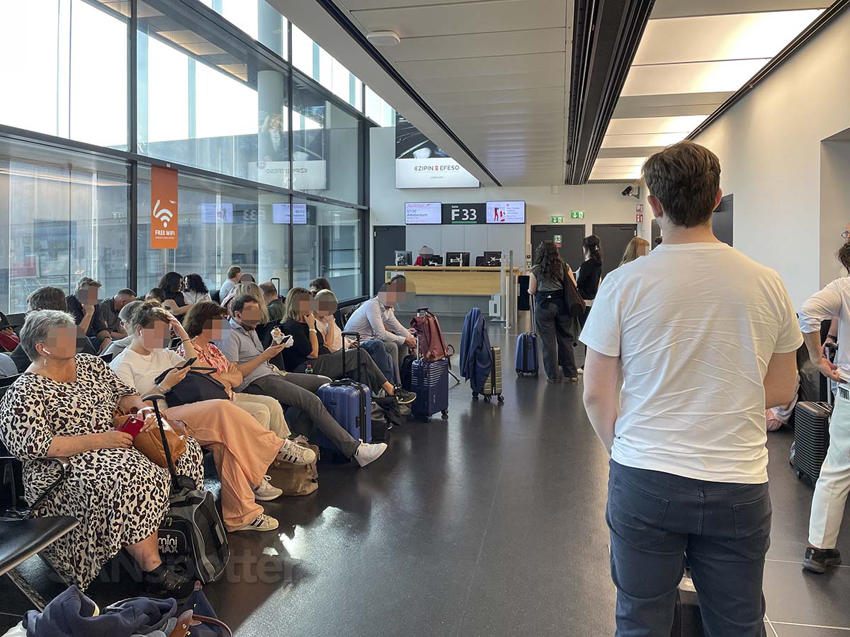 Passengers waiting for flight at Gate F33 VIE airport