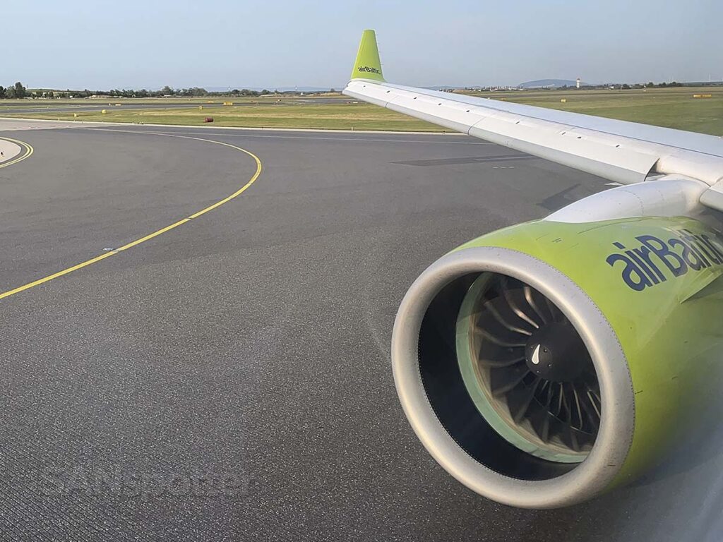 Air Baltic A220-300 lining up for departure Vienna airport