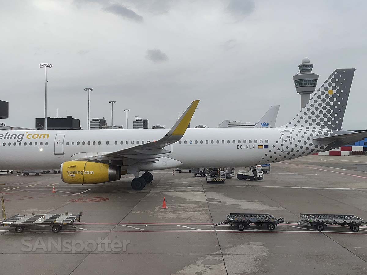 Pulling up to concourse B AMS next to a Vueling A321