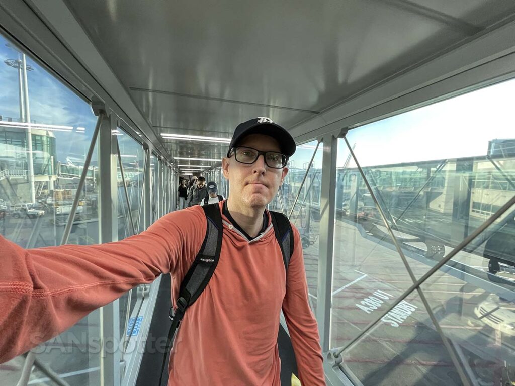 Scott (SANspotter) walking up a glass jet bridge at Incheon airport