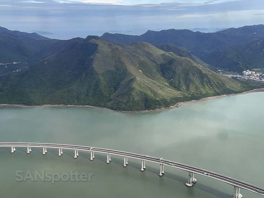 Overwater bridge and mountains as seen on approach into HKG