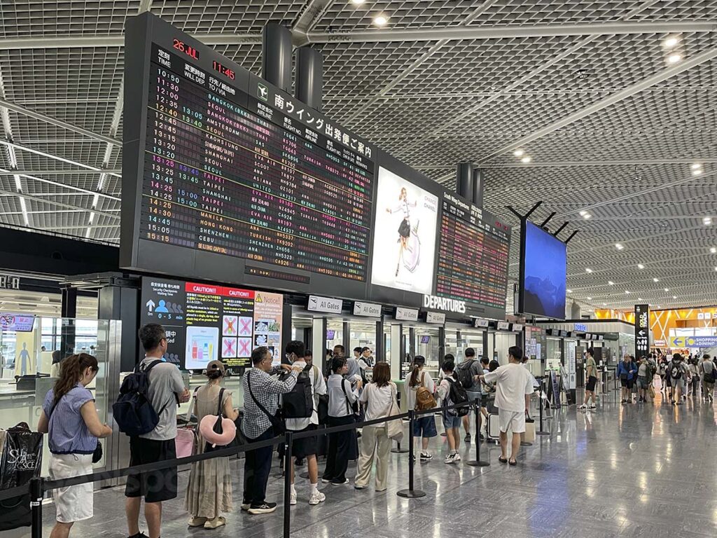 Terminal 1 at Narita departures board and security checkpoint line