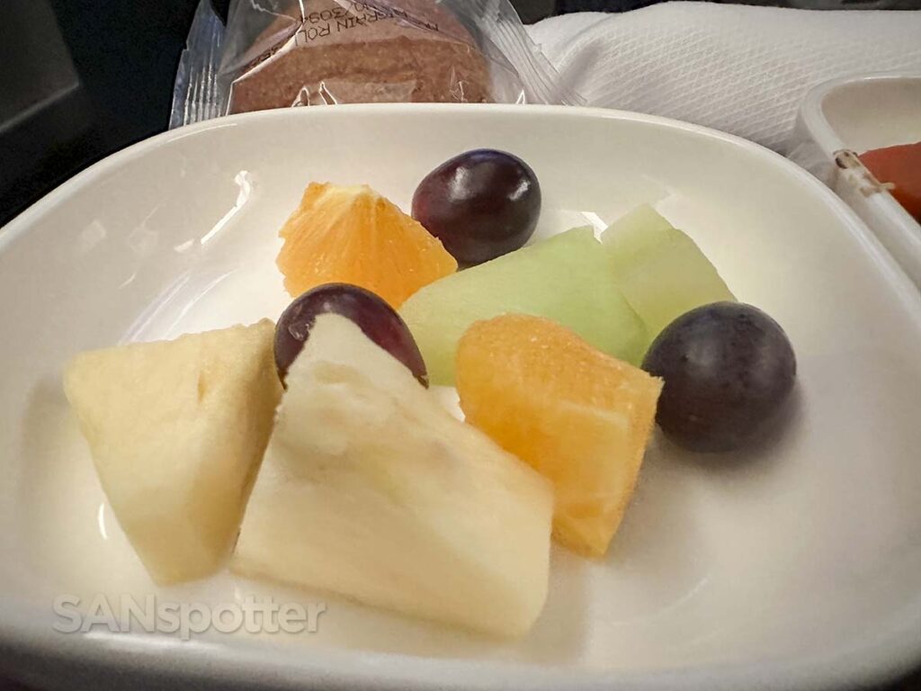 United Airlines 777-300ER Premium Plus pre-landing meal fruit plate