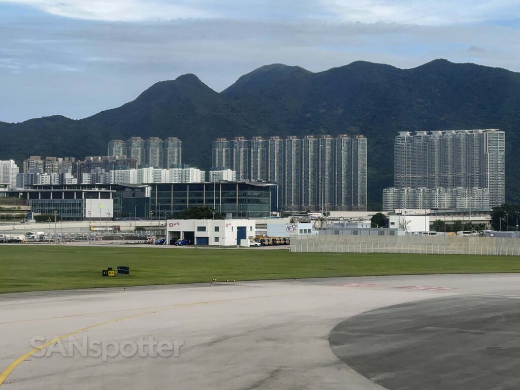 Buildings in the distance as seen in taxiing out for departure at Hong Kong international airport