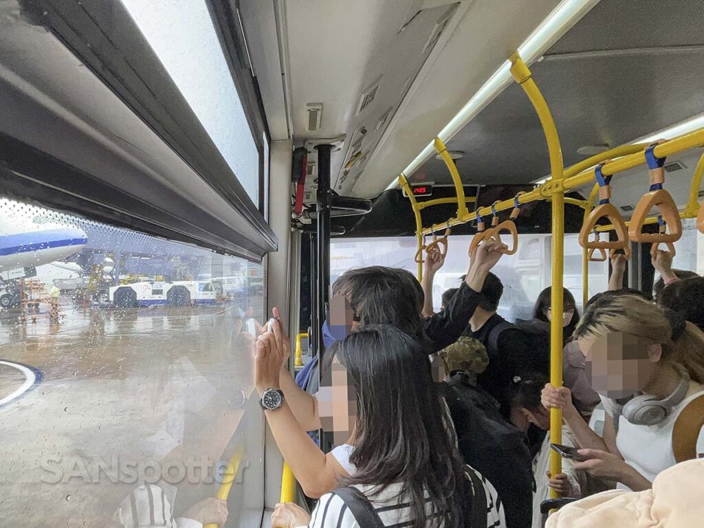 Passengers riding a bus to a remote gate at the Taoyuan International Airport