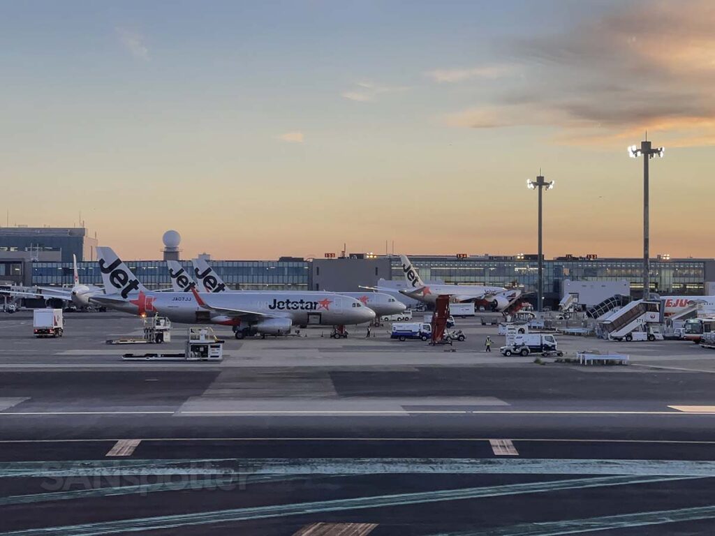 Jetstar aircraft parked at Narita airport just after sunset