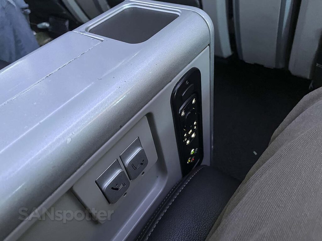 United Airlines 787-9 premium plus center console seat control buttons and remote for entertainment system