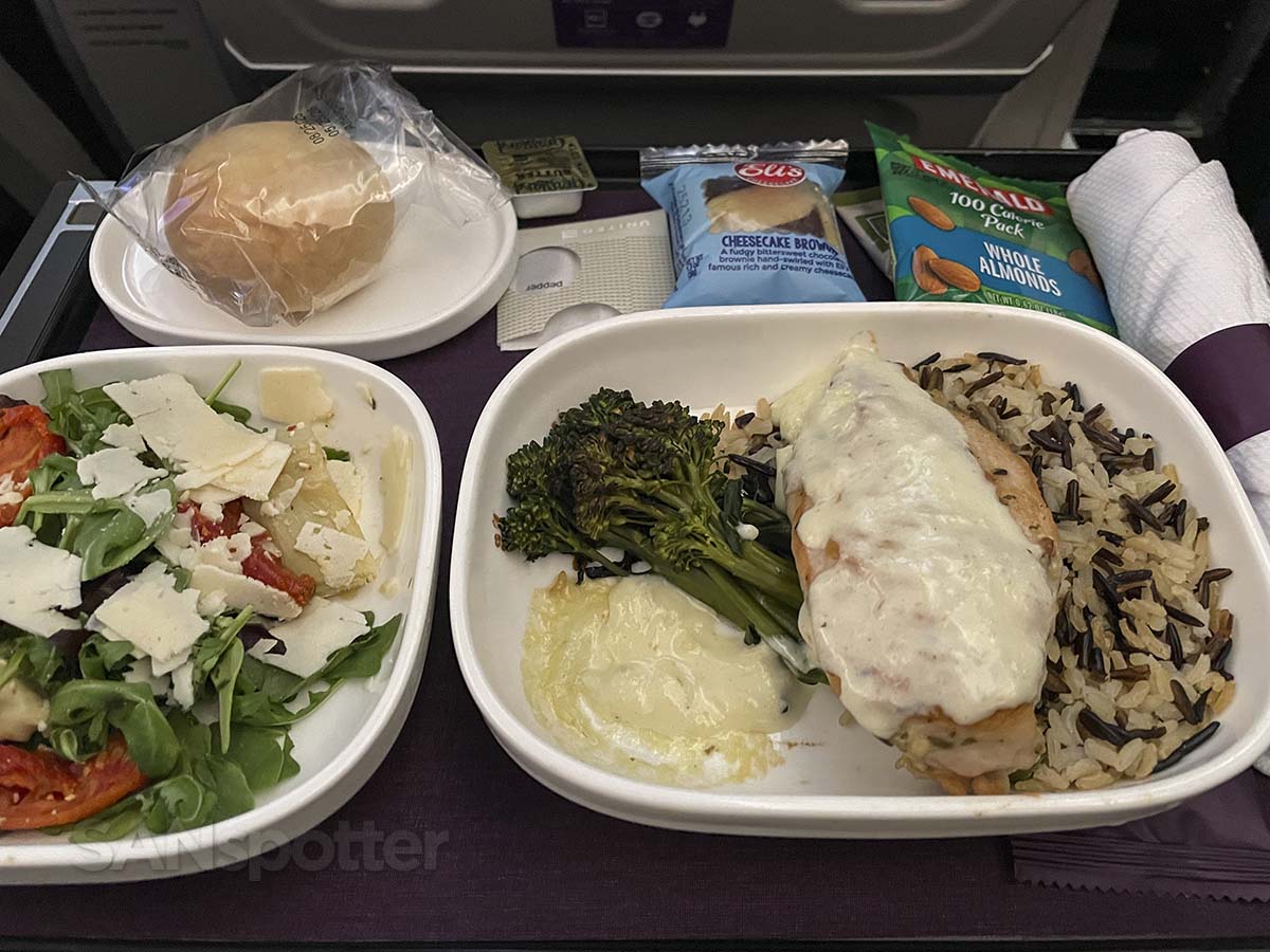 Chicken and rice meal tray in United Airlines 787-9 premium plus
