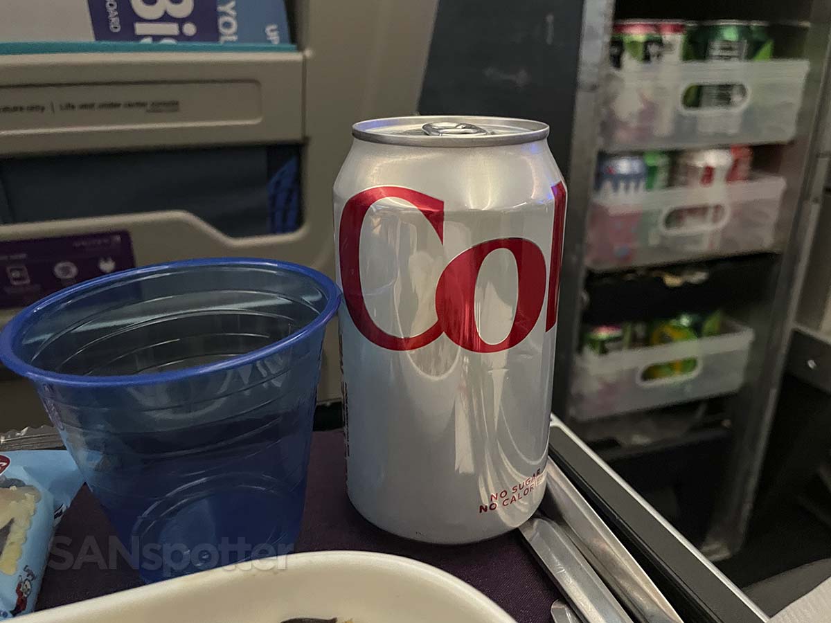 United Airlines 787-9 premium plus full can of soda