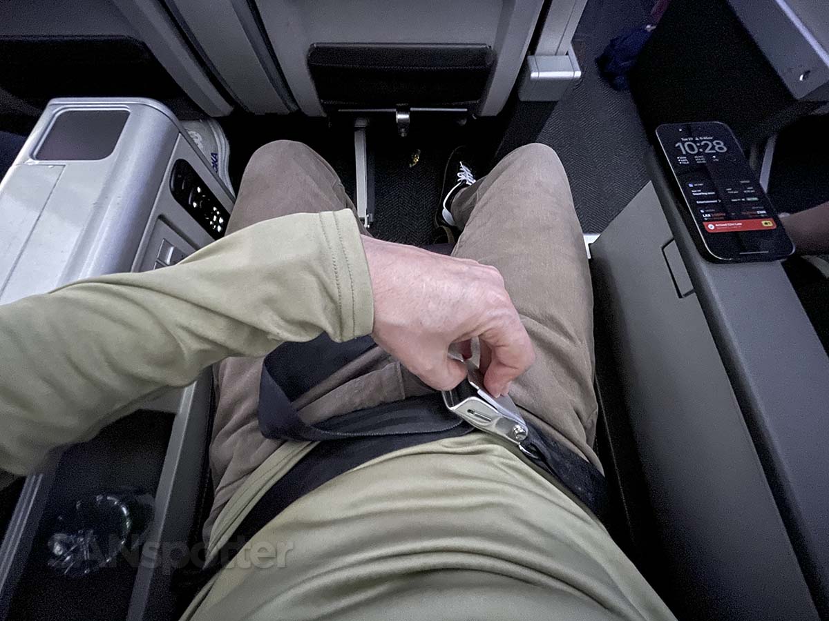 Unbuckling my seatbelt upon arrival in United Airlines 787-9 premium plus