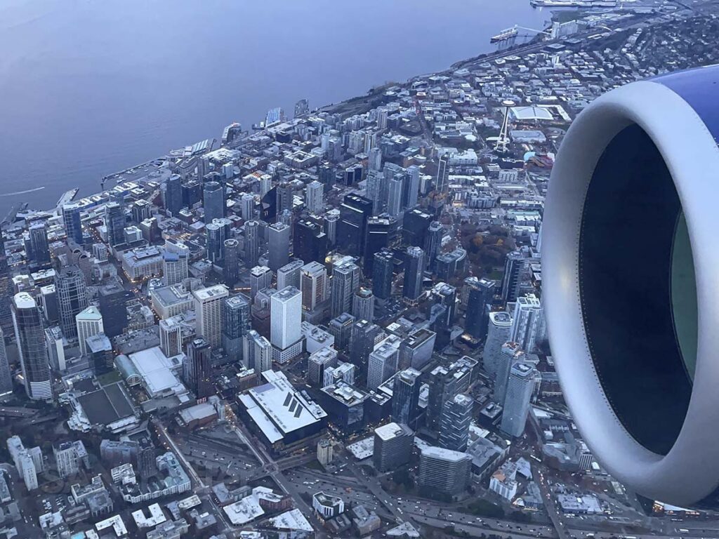 Delta A220-100 flying over downtown Seattle